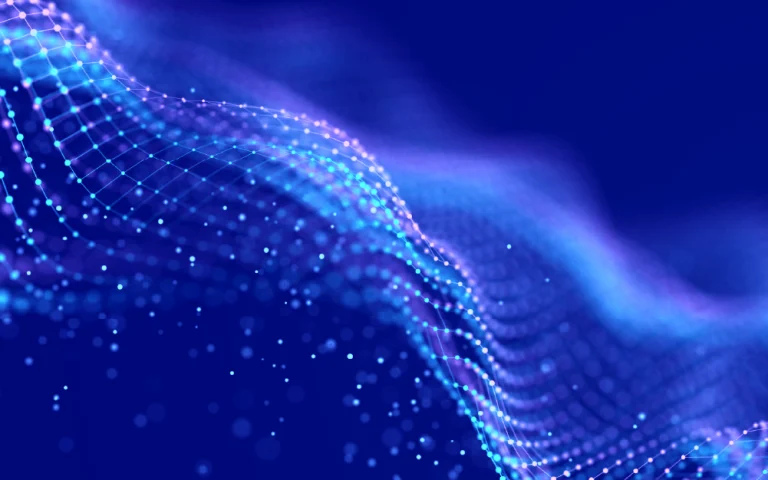 Digital mesh of blue-toned points forming an abstract wave on a dark background, symbolizing connectivity and data.