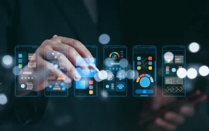 Hand using a digital stylus to interact with multiple mobile app interfaces, representing innovation and data-driven design.