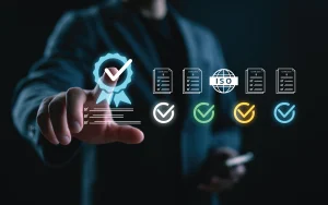 Professional interacting with a digital interface displaying certifications, ISO standards, and compliance indicators, symbolizing governance, quality, and security in digital channels.