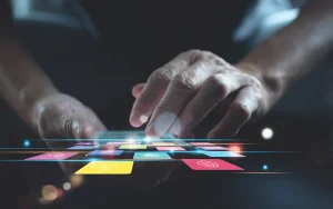 Hands touching a digital interface with colorful app icons, representing customer apps, mobile experiences, and advanced technology integration.